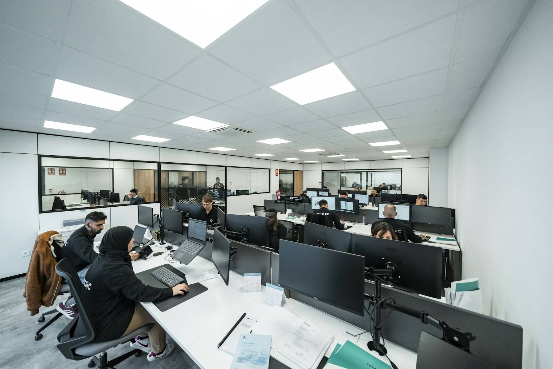 Analysts working in a dark technology operations centre